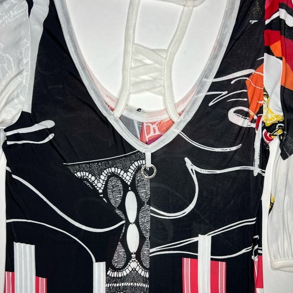 Save the Queen Ladies top. Medium Elbow length sleeves. Metal medallion accent. - Picture 7 of 13